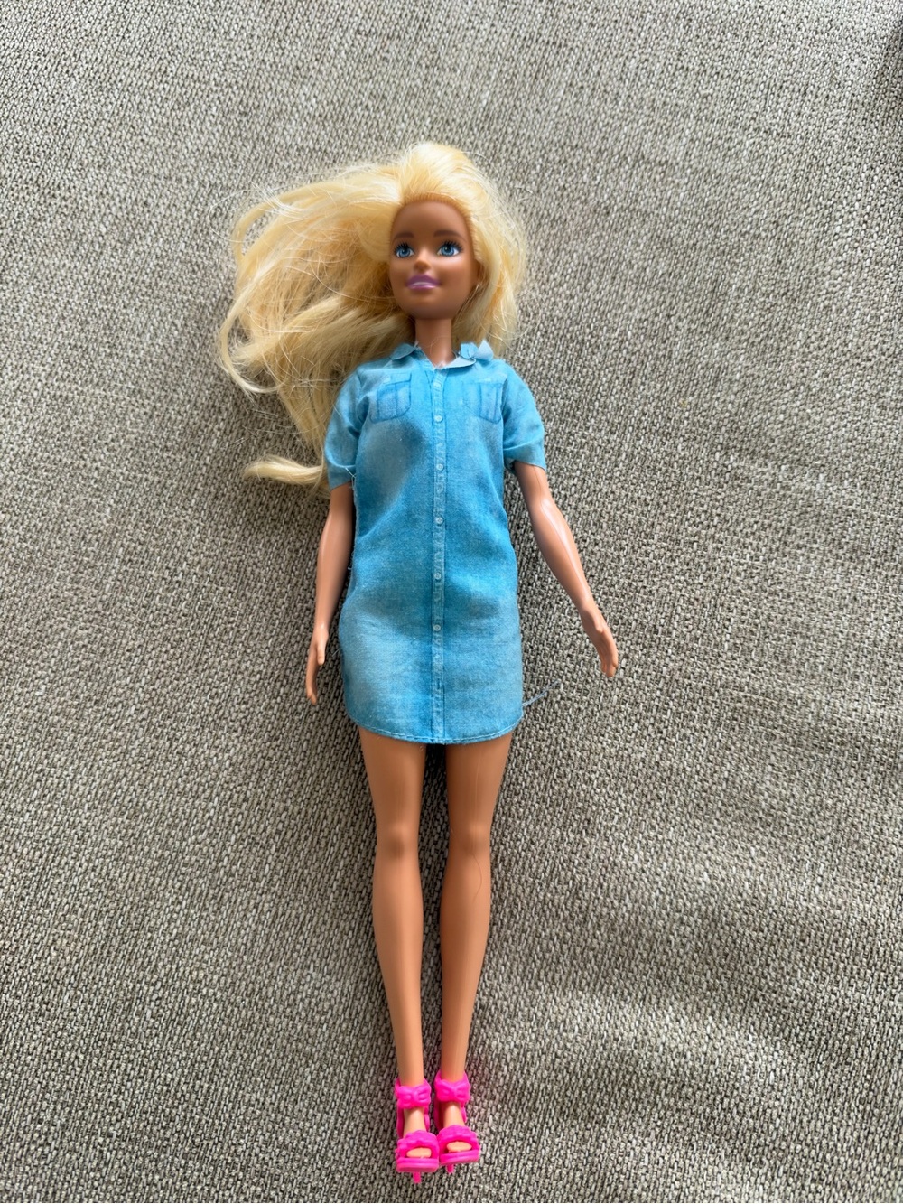 Barbie with blonde hair and denim dress